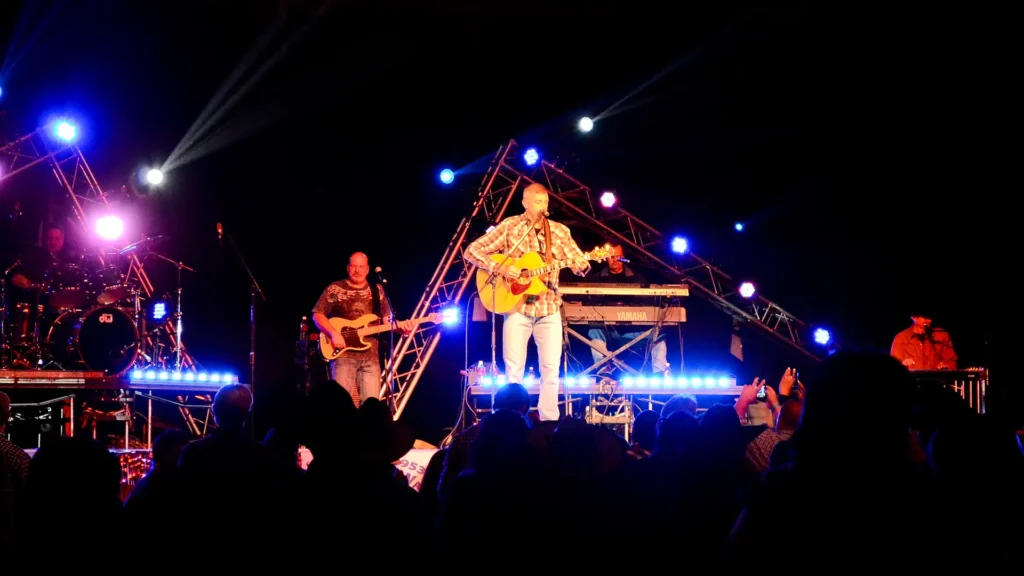 Man with guitar at pavillion